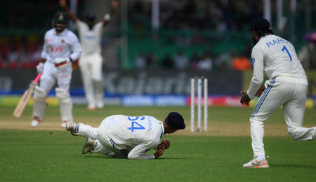 KANPUR, INDIA - SEPTEMBER 27: Indian cricketer Yashasvi Jaiswal dives for the catch of Bangladeshi Batsman Zakir Hasan during the first day of the Second Test cricket match between India and Bangladesh at Green Park Stadium on September 27, 2024 in Kanpurのeditorial素材