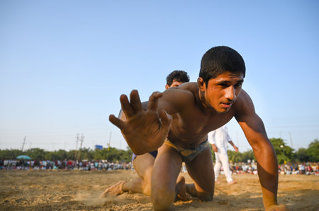 NOIDA, INDIA - OCTOBER 2: Wrestler plays Indian freestyle wrestling match on mud ground during a tournament match organized by local villagers in Sector 69, on October 2, 2024 in Noida, India. (Photo by Sunil Ghosh/Hindustan Times )のeditorial素材