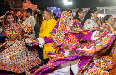 MUMBAI INDIA OCTOBER 3 2024 Girls playing garba during Navratri festival at Mahavir Nagar on October 3 2024 in Mumbai India Photo by Satish Bate Hindustan Timesのeditorial素材