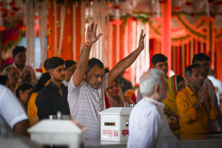 NEW DELHI INDIA OCTOBER 3 2024 Devotees seen offering prayers on the first day of Navratri Festival...