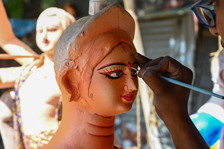 GURGRAM, INDIA - OCTOBER 6: Artists from West Bengal are making eco-friendly idols of Goddess Durga for the upcoming Durga Puja festival at a workshop in Chakkarpur village near Government Senior Secondary School, on October 6, 2024 in Gurugram, India. (Pのeditorial素材