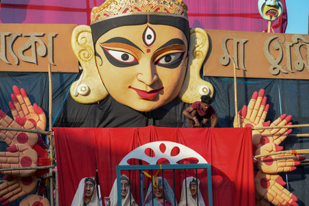 NEW DELHI, INDIA - OCTOBER 7: An artist giving final touches to the idols of goddess Durga ahead of...