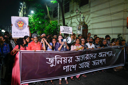 KOLKATA, INDIA - OCTOBER 8: Junior doctors along with citizens take out a protest rally from Medical College Hospital to Esplanade to support indefinite hunger strike by doctors and demanding justice for the murdered RG Kar trainee doctor and security forのeditorial素材