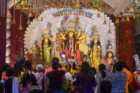 GURUGRAM, INDIA - OCTOBER 9: Devotees offer prayer to Goddess Durga during the Durga Puja festival...