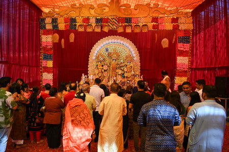 GURUGRAM, INDIA - OCTOBER 10: Devotees offers prayer to Goddess Durga during the Durga Puja festival...