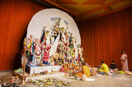 NOIDA, INDIA - OCTOBER 10: Devotees worship Goddess Durga on Saptami day at Noida Kale Bari Sector 26 on October 10, 2024 in Noida, India.  The festival of Durga Puja is often referred to as Durgotsav, which honors Goddess Durga. The term Durgotsav refersのeditorial素材