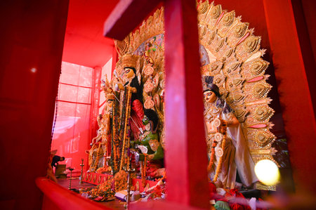 GURUGRAM, INDIA - OCTOBER 12: Women performing puja on Dashami during Durga Puja festival organised...
