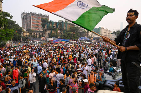 KOLKATA INDIA OCTOBER 15 2024 Citizen participate in mass protest demanding justice for RG Kar rape and murder incident and security for medical staff in hospitals near protest site where junior doctors continue their indefinite hunger strike at Esplanadeのeditorial素材
