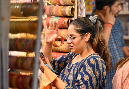 NEW DELHI, INDIA - OCTOBER 19: People shop Bangles at Hanuman Temple in Connaught Place, on the eve...