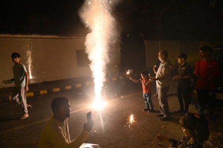 NEW DELHI INDIA OCTOBER 30 2024 Children bursting crackers on the eve of Diwali on October 30 2024 in New Delhi India Photo by Arvind Yadav Hindustan Timesのeditorial素材