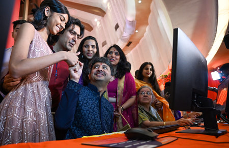 MUMBAI, INDIA - OCTOBER 31: Brokers, along with their families, trade as ceremonial purchases of stocks are made during the special Muhurat Trading session on the occasion of Diwali at the Bombay Stock Exchange on Friday, on October 31, 2024 in Mumbai, Inのeditorial素材