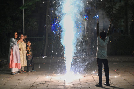 NOIDA, INDIA - OCTOBER 31: People light fireworks on the occasion of Diwali, the festival of Lights...