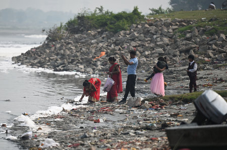 NEW DELHI, INDIA - NOVEMBER 3: Devotees taking holy dip and offering prayer before Chhath Puja, at Yamuna River near Kalindi Kunj, on November 3, 2024 in New Delhi, India. The Yamuna River is inundated with toxic foam ahead of Chhath Puja, set to be celebのeditorial素材
