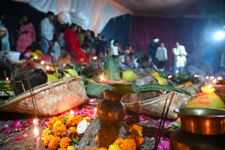 NOIDA INDIA NOVEMBER 8 2024 Devotees performing the rituals of offering Arghya to the rising sun in the Yamuna River on the fourth and last day of Chhath Puja A festival dedicated to Lord Surya Chhath Puja is celebrated with rich rituals over four days Roのeditorial素材