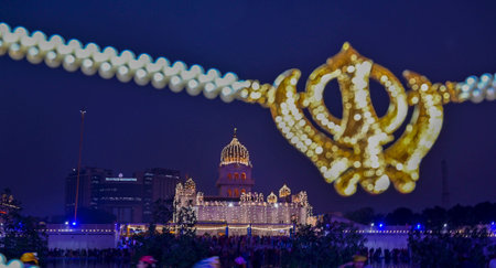 NEW DELHI, INDIA - NOVEMBER 15: A view of Gurudwara Bangla Sahib illuminated on the occasion of 555th Guru Nanak Jayanti on November 15, 2024 in New Delhi, India. Gurpurab, also known as Guru Nanak Prakash Utsav or Guru Nanak Jayanti, celebrates the birthのeditorial素材