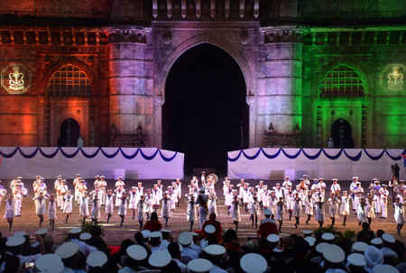 MUMBAI INDIA DECEMBER 4 2024 Naval staff performing beating the retreat during the Governor of Maharashtra CP Radhakrishnan and Vice Admiral Sanjay J Singh Flag Officer Commanding in Chief Western Naval Command during Indian Navy Day celebration at Gatewaのeditorial素材