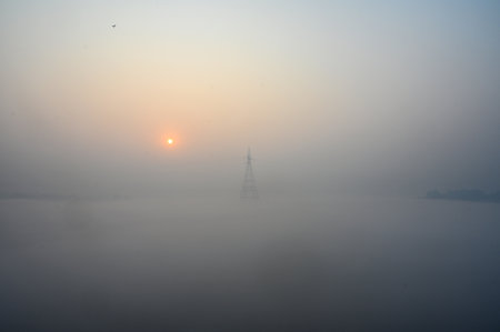 NEW DELHI INDIA DECEMBER 17 2024 A view of Yamuna River covered in fog near Kalindi Kunj on December...