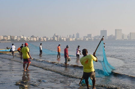 MUMBAI INDIA DECEMBER 16 2024 Fisheries Department Mangrove Foundation and local fisherman during the Ocean Plastic Clean up Campaign involved in collecting garbage plastic floating in the sea near Girgaon Chowpatty on December 16 2024 in Mumbai India Phoのeditorial素材