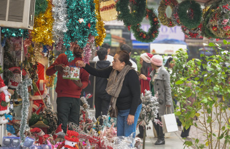 NEW DELHI INDIA DECEMBER 24 2024 People Shopping Fancy decoration items on the eve of Christmas celebrations at Khan Market on December 24 2024 in New Delhi India Photo by Raj K Raj Hindustan Timesのeditorial素材