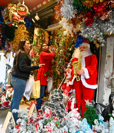NEW DELHI INDIA DECEMBER 24 2024 People Shopping Fancy decoration items on the eve of Christmas celebrations at Khan Market on December 24 2024 in New Delhi India Photo by Raj K Raj Hindustan Timesのeditorial素材