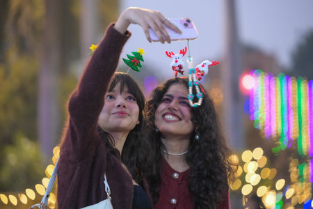 NEW DELHI INDIA DECEMBER 24 2024 Devotees Taking Selfie at the Sacred Heart Cathedral Church on the eve of Christmas Day celebrations on December 24 2024 in New Delhi India Photo by Raj K Raj Hindustan Timesのeditorial素材
