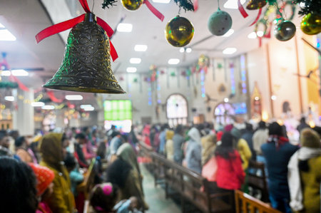 NOIDA, INDIA - DECEMBER 25: Devotees offer prayers inside a St. Mary's church at Sector 34 on the occasion of Christmas, on December 25, 2024 in Noida, India. (Photo by Sunil Ghosh/Hindustan Times )のeditorial素材