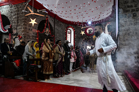 NEW DELHI, INDIA - DECEMBER 25: Devotees at Holy Trinity Church for the special prayer on the occasion of Christmas Festival, at Turkman Gate, on December 25, 2024 in New Delhi, India. (Photo by Salman Ali/Hindustan Times )のeditorial素材