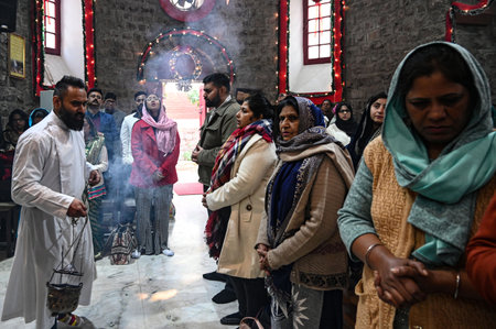 NEW DELHI, INDIA - DECEMBER 25: Devotees at Holy Trinity Church for the special prayer on the occasion of Christmas Festival, at Turkman Gate, on December 25, 2024 in New Delhi, India. (Photo by Salman Ali/Hindustan Times )のeditorial素材