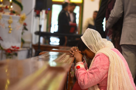 GURUGRAM, INDIA - DECEMBER 25: Christian devotees offer prayers in the Church of the Epiphany on the occasion of Christmas at civil lines near Tank Park, on December 25, 2024 in Gurugram, India. (Photo by Parveen Kumar/Hindustan Times )のeditorial素材