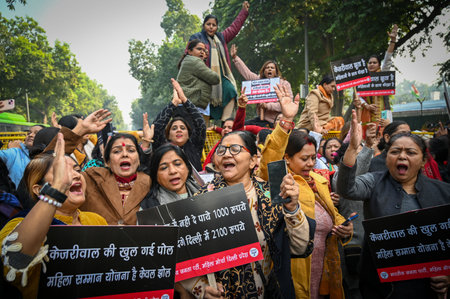 NEW DELHI, INDIA - DECEMBER 26: Members of Delhi BJP Mahila Morcha stage a protest near former Delhi chief minister and AAP national convenor Arvind Kejriwal's residence, on December 26, 2024 in New Delhi, India. Delhi BJP Mahila Morcha protest outside AAのeditorial素材