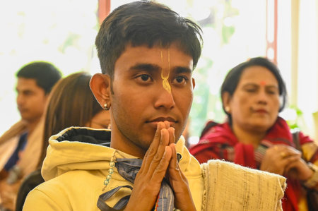 KOLKATA, INDIA - DECEMBER 31: International Society for Krishna Consciousness (ISKCON) devotees during a special prayer and chant for the safety and security of Bangladeshi minorities at ISKCON Temple, on December 31, 2024 in Kolkata, India. (Photo by Samのeditorial素材