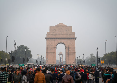NEW DELHI, INDIA - DECEMBER 30: Tourists seen at Kartavya Path on a winter evening at India Gate, on December 30, 2024 in New Delhi, India. North India is reeling under cold weather with temperatures plummeting across several states. As per IMD, the minimのeditorial素材