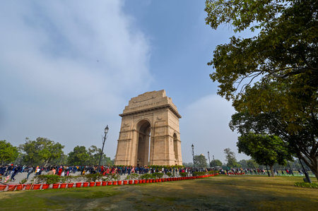 NEW DELHI, INDIA - DECEMBER 30: Visitors enjoy India gate during the Clean and cold Afternoon on December 30, 2024 in New Delhi, India. North India is reeling under cold weather with temperatures plummeting across several states. As per IMD, the minimum tのeditorial素材
