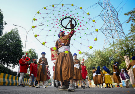 NOIDA, INDIA - JANUARY 5:  Sikh devotees display Gatka martial art skills during a 'Nagar Kirtan' procession taken out as part of 'Prakash Utsav', a day before the 358th birth anniversary of the 10th and last Sikh Guru Gobind Singh, on January 5, 2025 in のeditorial素材