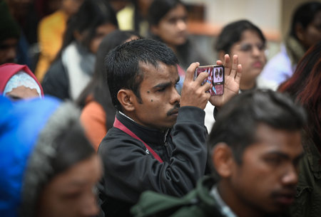 NEW DELHI, INDIA - JANUARY 4: Students who received laptops and tablets during âSamarpan Samarohâ, an event celebrating philanthropy, excellence, and community service, at North Campus, Delhi University , on January 4, 2025 in New Delhi, India. The evのeditorial素材