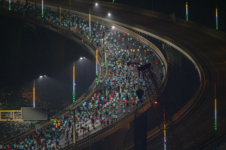 MUMBAI, INDIA - JANUARY 19: Runners participating in the 2025 Tata Mumbai Marathon, running on the...