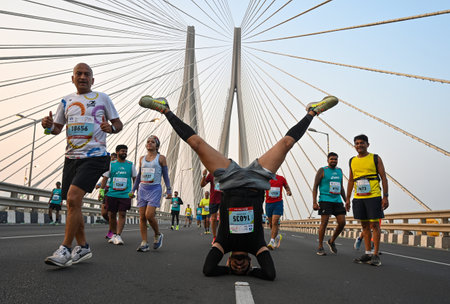 MUMBAI, INDIA - JANUARY 19: Runners participating in the 2025 Tata Mumbai Marathon, running on the Worli-Bandra Sea Link, on January 19, 2025 in Mumbai, India. The Mumbai Marathon is a World Athletics Gold Label Race and it sees people from India and abroのeditorial素材