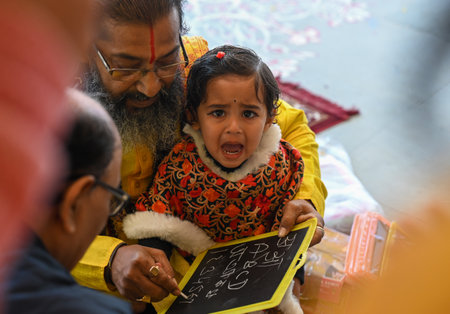 NOIDA, INDIA - FEBRUARY 3: A child during \Hate Khori\- a ceremony where little children are...