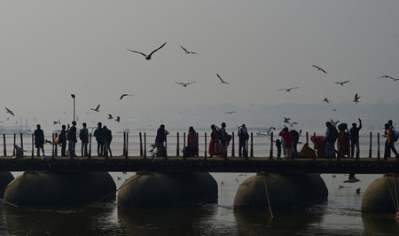 PRAYAGRAJ, INDIA - JANUARY 29: Devotees walk over the pontoon bridge during 'Mauni Amavasya' at...