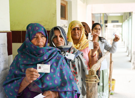 NEW DELHI INDIA FEBRUARY 5 2025 People cast their vote at a booth centre at Bamnoli Village in South West Delhi on February 5 2025 in New Delhi India A voter turnout of 57 per cent was recorded till 5 pm the Election Commission of India said The voting beのeditorial素材