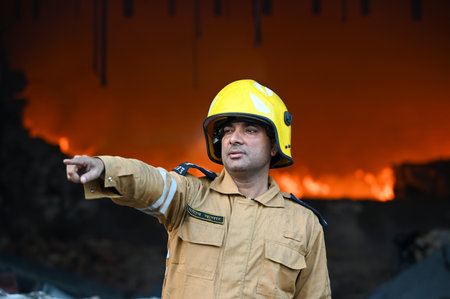 NOIDA, INDIA - FEBRUARY 15: Firefighters dousing the fire that broke out at a company manufacturing...