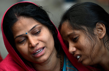 NEW DELHI, INDIA - FEBRUARY 16: Family members of Pinki Devi (who died) in grief at residence near Sangam Vihar, after New Delhi Railway station stampede last night, on February 16, 2025 in New Delhi, India. At least 18 people were killed and more than a のeditorial素材