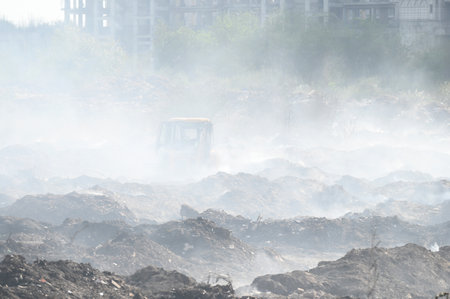 NOIDA, INDIA - MARCH 9: On Fifth day Firefighters try to douse a fire at a horticulture waste...