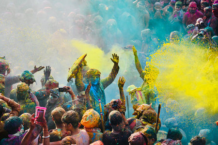 MATHURA, INDIA - MARCH 9: People smear each other with coloured powder Gulal during the Lathmar Holi...