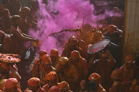 MATHURA, INDIA - MARCH 9: People smear each other with coloured powder Gulal during the Lathmar Holi festival, at Nandji Temple, on March 9, 2025 in Mathura, India. (Photo by Raj K Raj/Hindustan Times )のeditorial素材