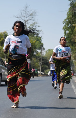 LUCKNOW, INDIA - MARCH 8: Housewives participating in the Saree Marathon organised on the occasion of International Women's Day at KD Singh Babu stadium, on March 8, 2025 in Lucknow, India. International Women's Day commemorates women's fight for equalityのeditorial素材
