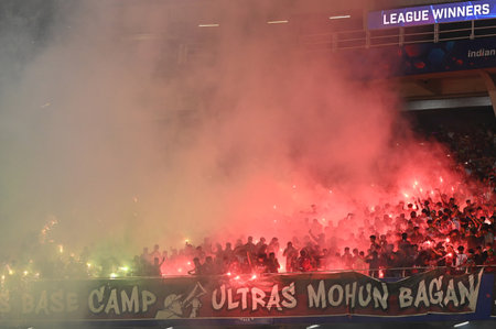 KOLKATA, INDIA - MARCH 8: Mohun Bagan SG supporters celebrate the win against FC Goa during Indian Super League (ISL) match at Salt lake Stadium on March 8, 2025 in Kolkata, India. (Photo by Samir Jana/Hindustan Times )のeditorial素材