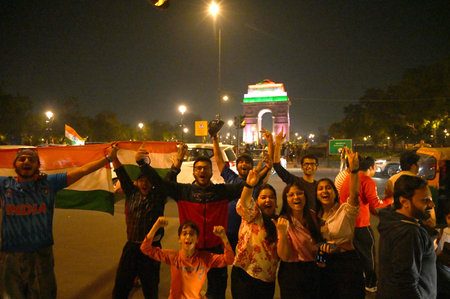 NEW DELHI INDIA MARCH 9 2025 Cricket fans celebrates India winning the ICC Champions Trophy 2025...