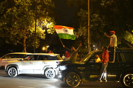 NEW DELHI INDIA MARCH 9 2025 Cricket fans celebrates India winning the ICC Champions Trophy 2025...