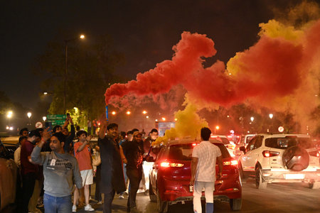 NEW DELHI INDIA MARCH 9 2025 Cricket fans celebrates India winning the ICC Champions Trophy 2025 near India Gate on March 9   2025 in New Delhi   India   Captain Rohit Sharma led Indian team to four-wicket triumph over New Zealand in the Champions Trophy のeditorial素材